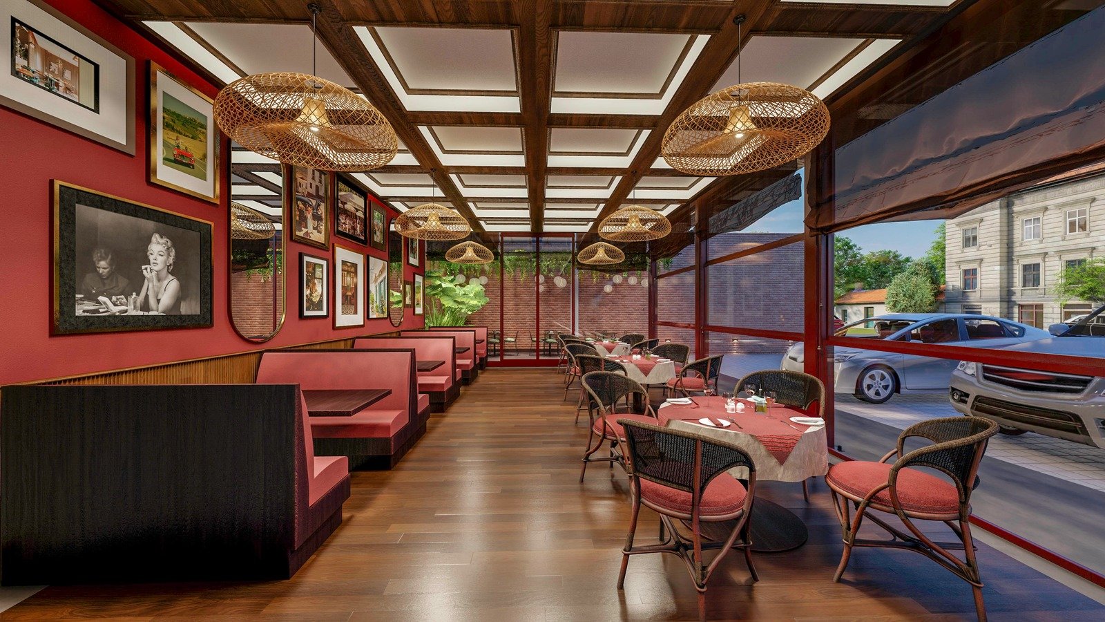 Indoor dining area featuring deep red walls, patterned ceiling panels, woven bamboo lampshades, and classic red booth seating